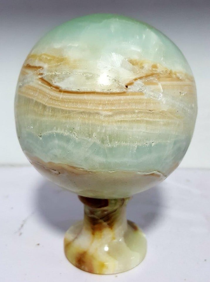 Beautifully Polished Carrabian Calcite Sphere - 1350 Grams: Beautifully Polished Carrabian Calcite Sphere - 1350 GramsShipping Rate: $90.00 .shipping rates are determined by Parcel weight and destination.Combined shipping: We offer combine shipping on multiple