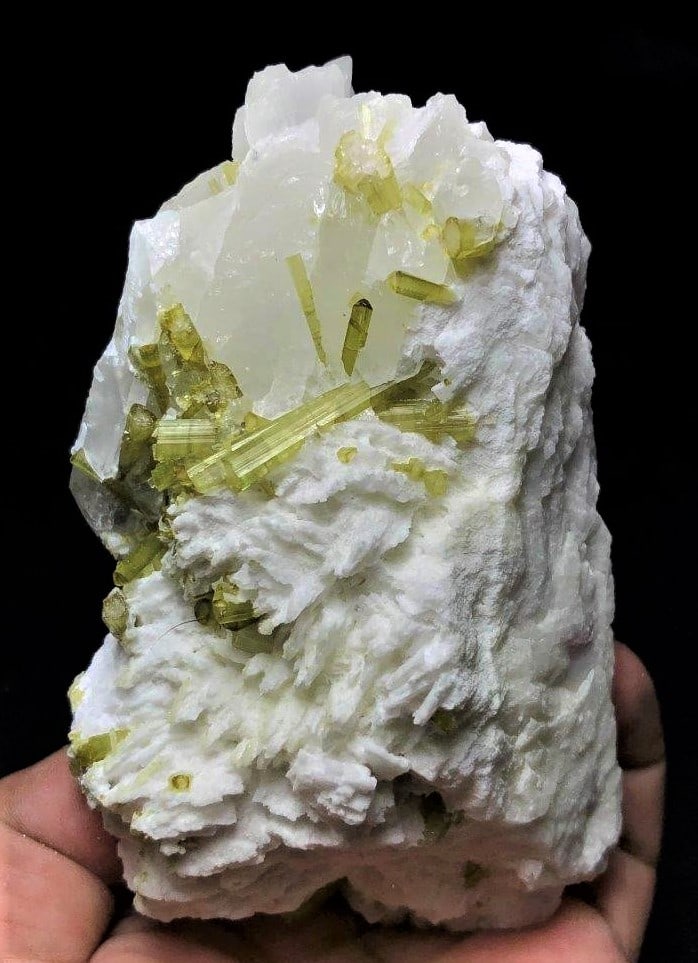 Green Tourmaline With Feldspar - 441 Grams: Green Tourmaline With Feldspar - 441 Grams - 117X71X55 mmShipping Rate: $45.00 .shipping rates are determined by Parcel weight and destination.Combined shipping: We offer combine shipping on multiple