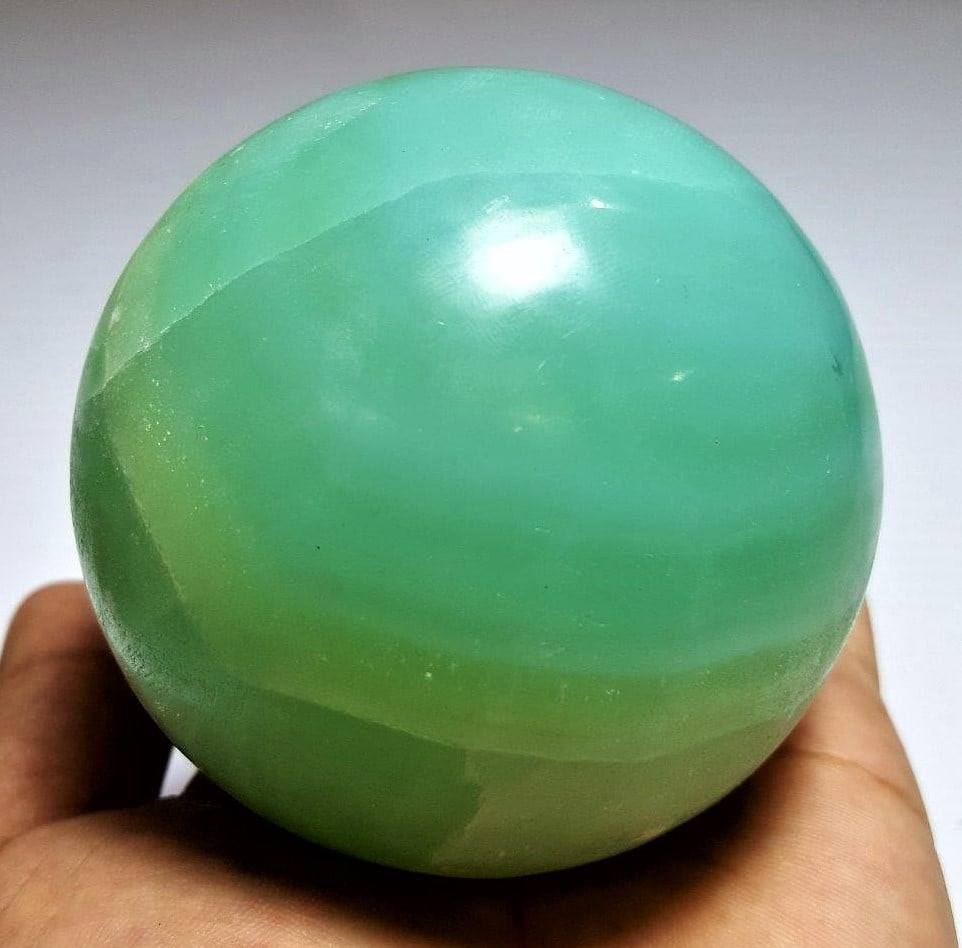 Top Quality Pistachio Calcite Sphere - 685 Grams: Top Quality Pistachio Calcite Sphere - 685 Grams - Diameter 79 mmShipping Rate: $60.00 .shipping rates are determined by Parcel weight and destination.Combined shipping: We offer combine shipping on m