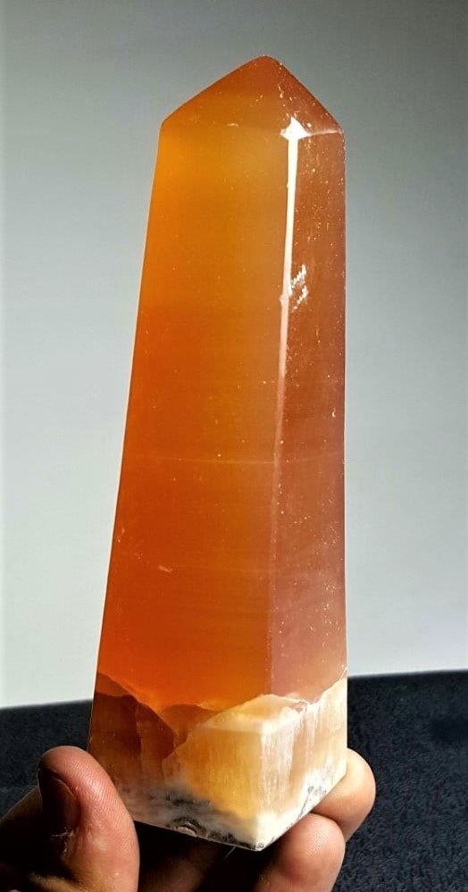 Honey Calcite Crystal Tower - 330 Grams: Large Honey Calcite Crystal Tower from Iceland - 330 GramsShipping Rate: $45.00 .shipping rates are determined by Parcel weight and destination.Combined shipping: We offer combine shipping on multiple