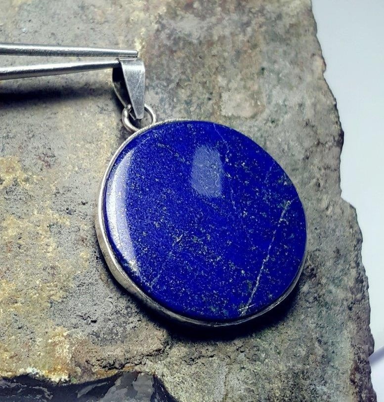 Royal Blue Round Lapis Pendant: Royal Blue Round Lapis Pendant - 27X4 mm Shipping: $23.00. Shipping rates are determined by Parcel weight and destination.