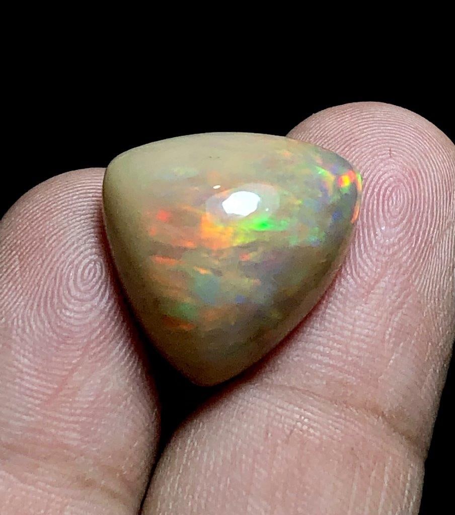 13.70 Carats Trillion Cut Opal From Ethopia - 18X17X10 mm: 13.70 Carats Trillion Cut Opal From Ethopia - 18X17X10 mmShipping Rate: $15.00 .shipping rates are determined by Parcel weight and destination.Combined shipping: We offer combine shipping on multiple