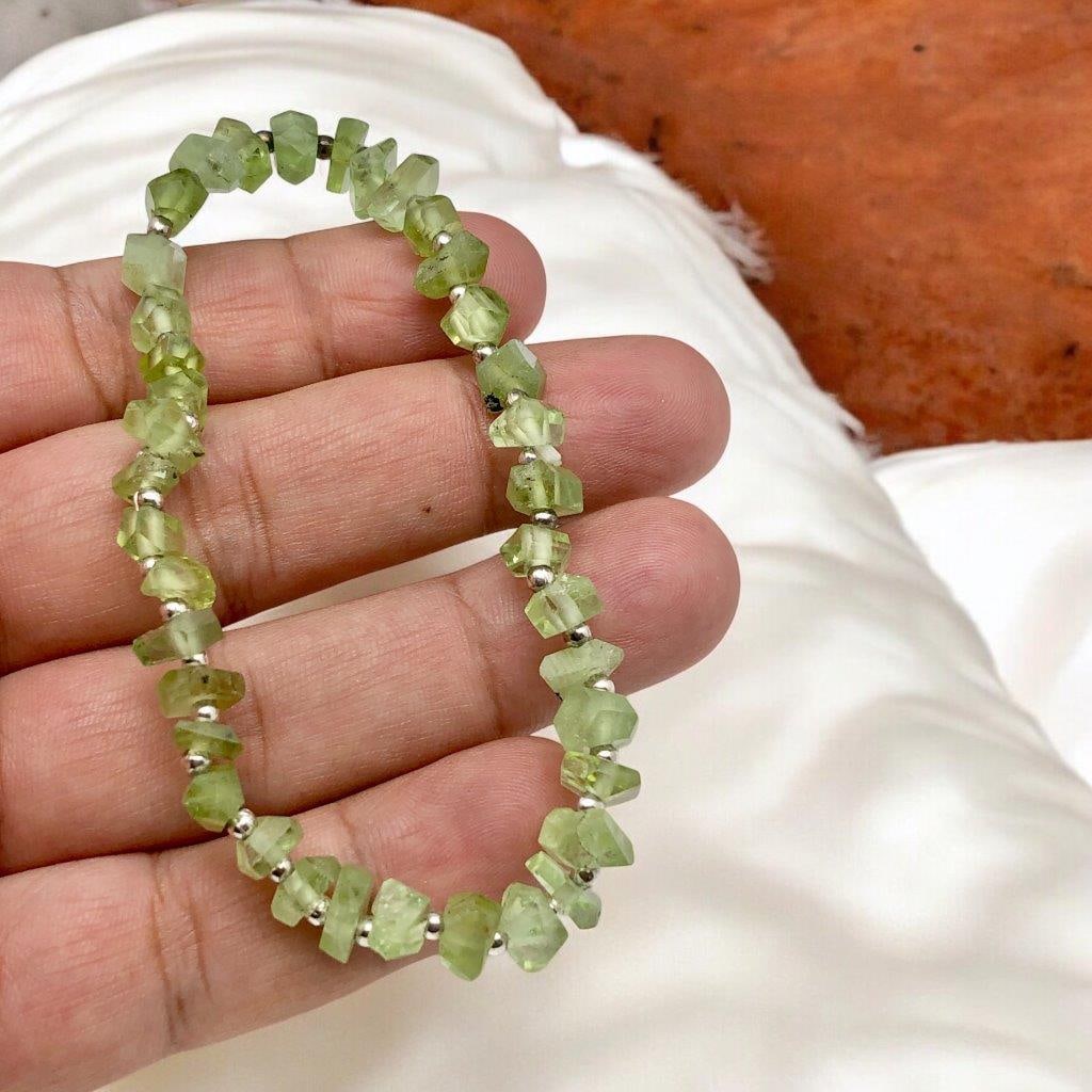 RAW PERIDOT STRETACHABLE HEALING BRACELET: RAW PERIDOT STRETACHABLE HEALING BRACELET Shipping: $25.00. Shipping rates are determined by Parcel weight and destination.