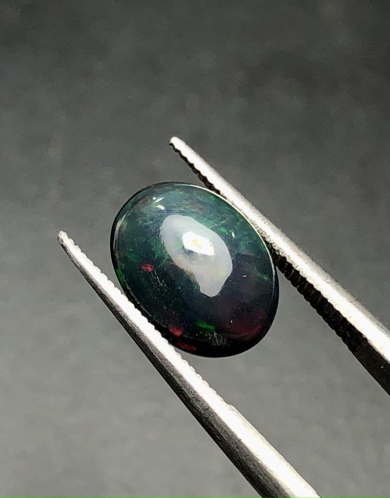 1.30 Carats Natural Black Opal - 10X8X4 mm: 1.30 Carats Natural Black Opal - 10X8X4 mm Shipping: