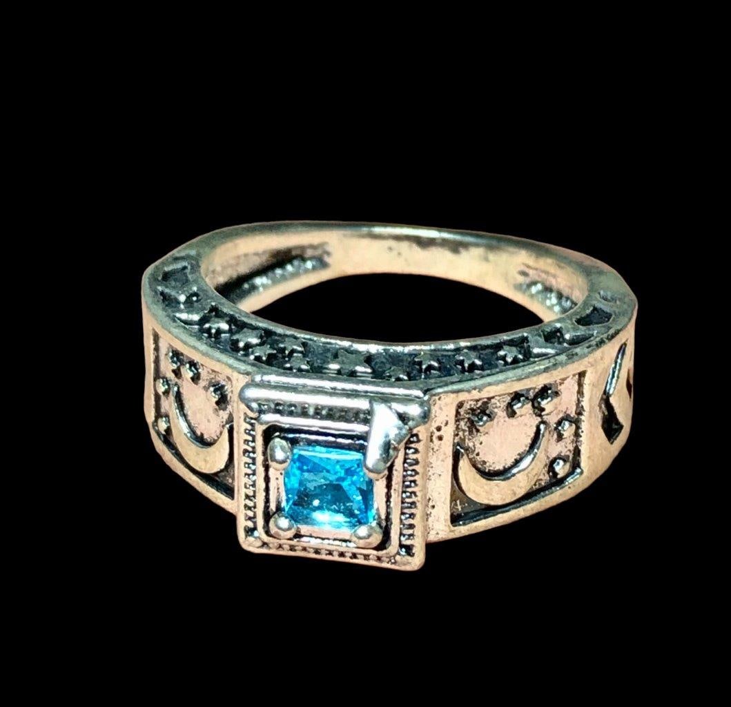 Rhodium Plated BLue Zirconia Solitaire Copper Ring: Rhodium Plated BLue Zirconia Solitaire Copper Ring FREE SHIPPING Shipping rates are determined by Parcel weight and destination.