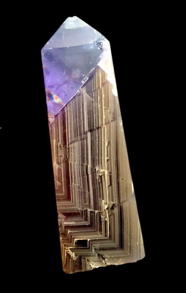 Natural Purple Fluorite Point Tower – 220 Grams Polished Crystal: Add a touch of natural beauty to your collection with this natural purple fluorite crystal shaped into a polished point tower, weighing 220 grams. Known for its rich purple hues, clarity, and unique