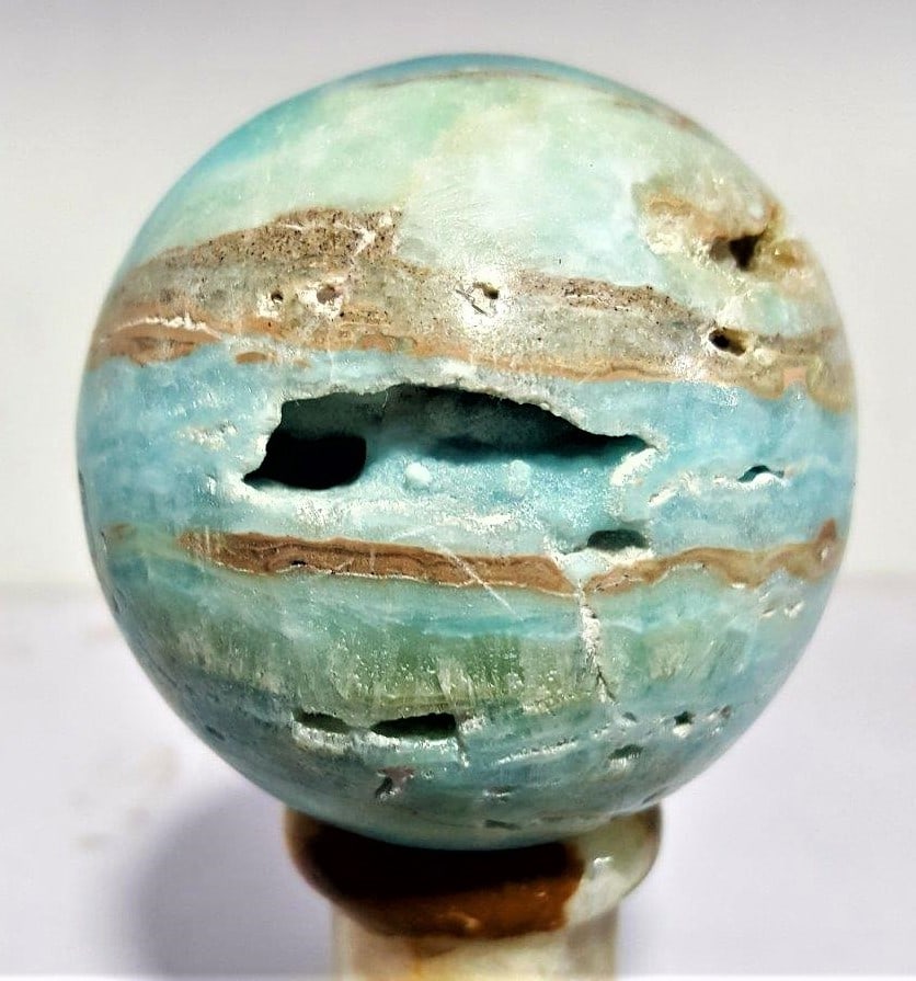 Itched Carrabian Calcite Healing Sphere - 550 Grams: Itched Carrabian Calcite Healing Sphere - 550 GramsShipping Rate: $55.00 .shipping rates are determined by Parcel weight and destination.Combined shipping: We offer combine shipping on multiple items