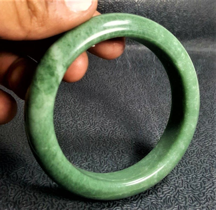 Natural Jade bangle bracelet round healing stone: Natural Jade bangle bracelet round healing stoneShipping Rate: $23.00 .shipping rates are determined by Parcel weight and destination.Combined shipping: We offer combine shipping on multiple items pur