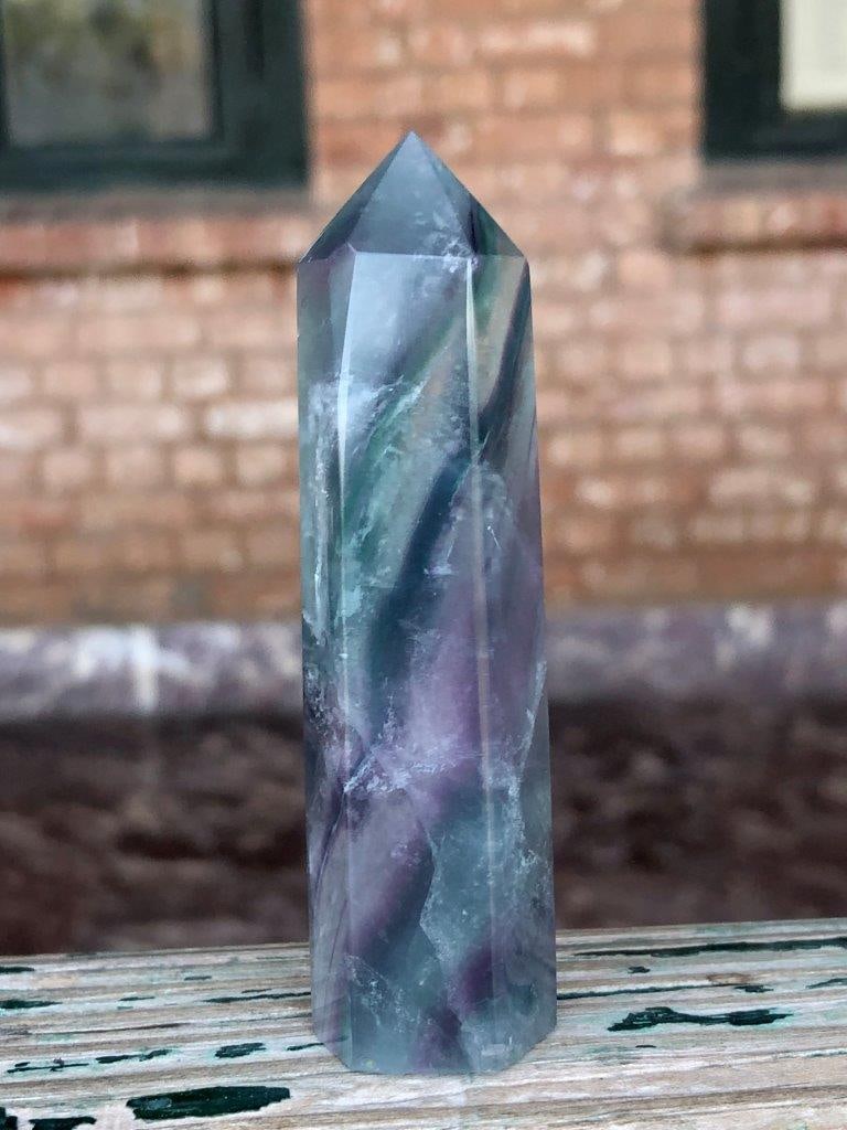 Natural Fluorite Crystal Tower – 73g Polished Healing Point, 8 cm Energy Stone Obelisk: Add a touch of natural elegance to your collection with this Natural Fluorite Crystal Tower, beautifully polished to showcase its vibrant colors and internal clarity. Featuring subtle banding and a mi