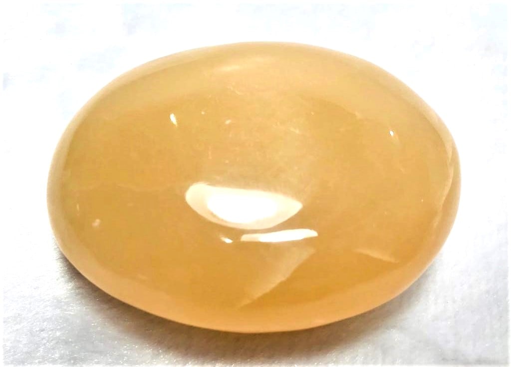 Honey Calcite oval shape stone 175.3G: Honey Calcite stone oval shape stone - 175.3G - 72X53X28mm Shipping: $23.00. Shipping rates are determined by Parcel weight and destination.