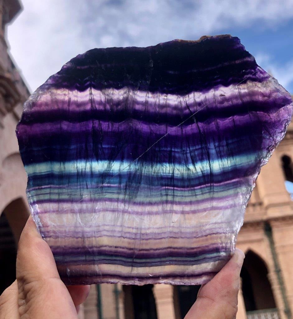 Natural Rainbow Fluorite Slice – 360g Polished Crystal Slab, 12 x 11.5 x 1 cm Energy Stone Décor: Showcase the natural beauty of minerals with this Natural Rainbow Fluorite Slice, a stunning crystal slab featuring vibrant bands of green, purple, and translucent hues. Carefully polished to enhance