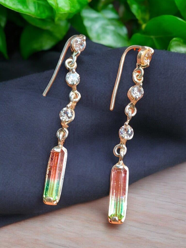 Sterling Silver Bi Color Tourmaline Earrings with Zircons: Sterling Silver Bi Color Tourmaline Earrings with Zircons Stones weight: 2.20 Cts - Dimensions: 11X3X2 mmZircons: 2 Carats Silver: 4 Grams Choose design of your own and we will make it for youWe