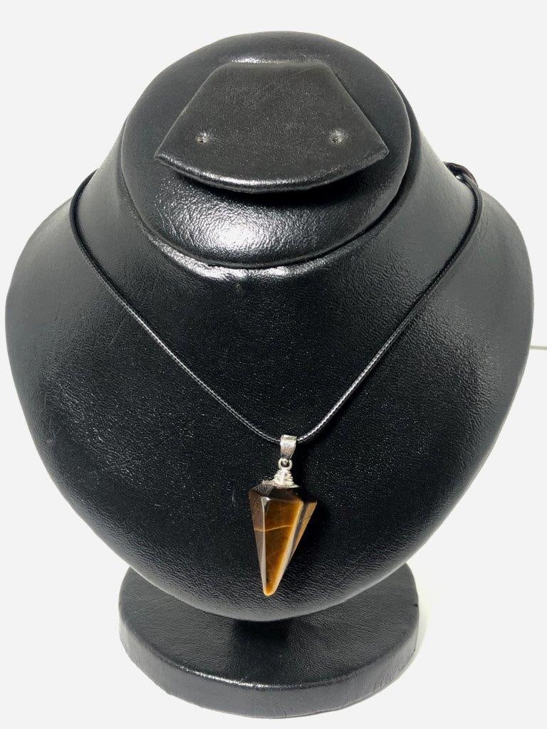 Carved Tiger Eye Pendant in Sterling Silver – Hand-Carved Gemstone: This impressive carved Tiger Eye pendant features a natural gemstone skillfully hand-carved to enhance its rich golden-brown tones and signature chatoyancy (cat’s-eye effect). The detailed carving a
