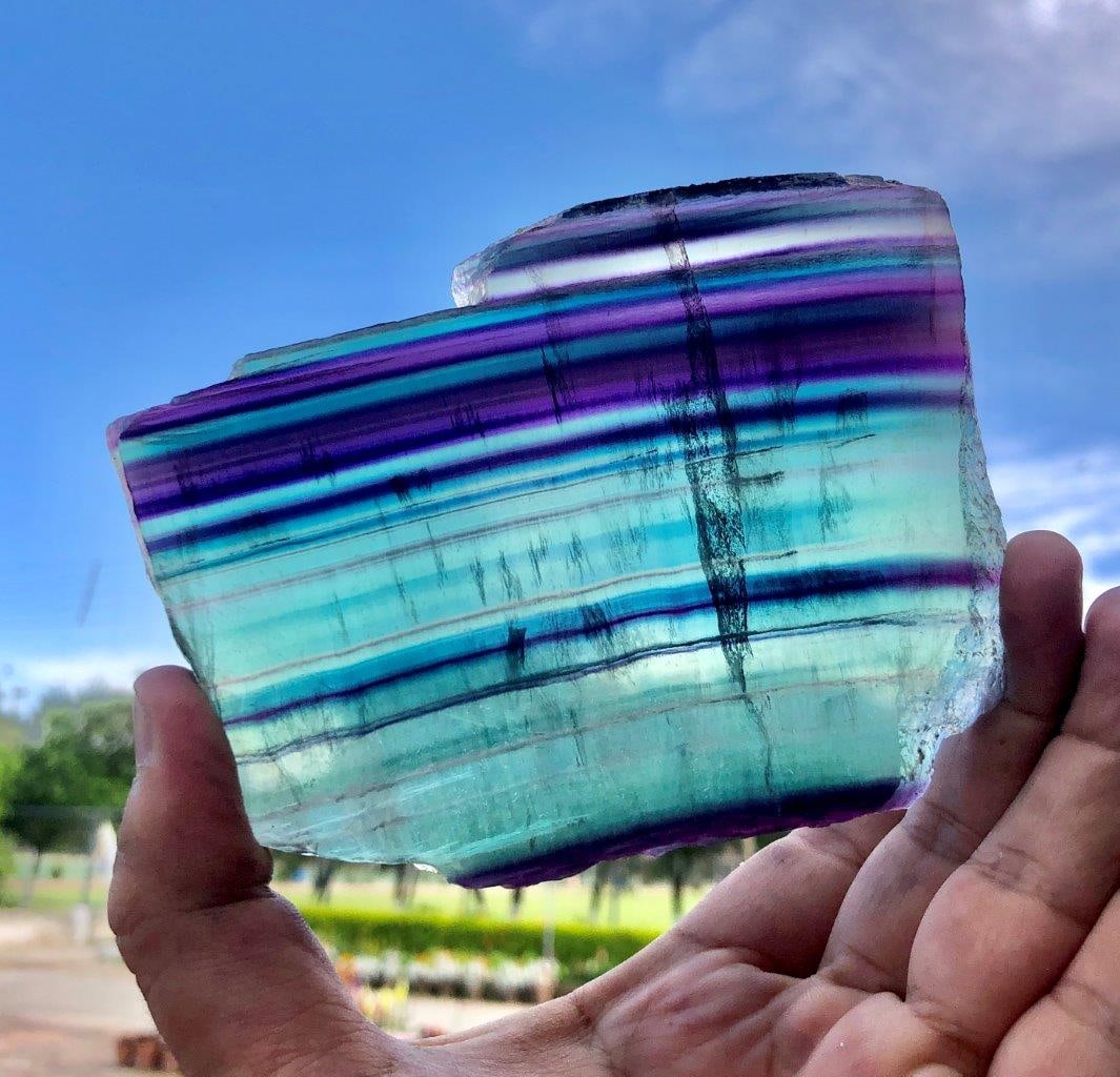 Natural Rainbow Fluorite Slice – 314g Polished Crystal Slab, 11x8x1 cm Energy Stone Décor: Bring natural beauty into your space with this Natural Rainbow Fluorite Slice, a stunning crystal slab showcasing vibrant bands of green, purple, and translucent tones. Expertly polished to enhance it