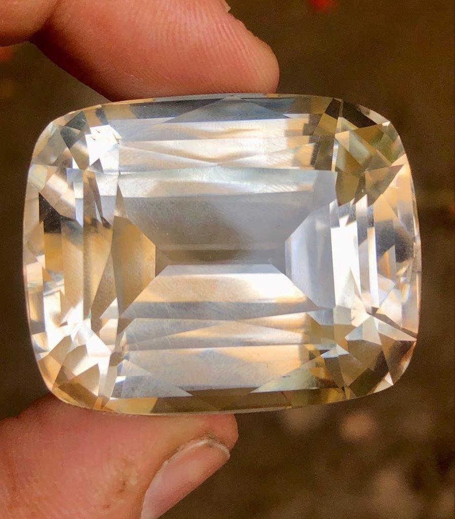 253.90 Carats Huge Natural Golden Topaz – Collector’s Gemstone (37×30×25 mm) – Rare Large: This impressive 253.90 carat natural Golden Topaz is a remarkable collector’s gemstone, showcasing a rich golden hue and a bold, eye-catching presence. Measuring 37 × 30 × 25 mm, this large specim