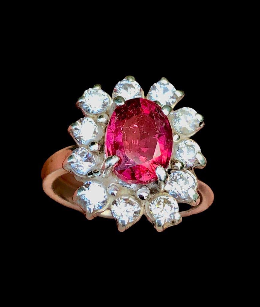 Rubelite Tourmaline Ring in Silver With Zircons: Rubelite Tourmaline Ring in Silver With ZirconsStone Weight: 3.20 Carats Ring Size: 7.5 US(Adjustable)Ring Weight: 5.80 GramsZircons: 60 Cents Choose design of your own and we will make it for youWe a