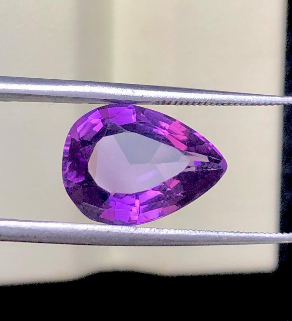 Deep Purple Amethyst Gemstone – 4.85 Cts Natural Loose Stone 14x10x7 mm: Stunning 4.85 carats natural deep purple Amethyst gemstone featuring rich violet color, excellent clarity, and brilliant sparkle. Measuring 14x10x7 mm, this elegant loose gemstone is perfect for custo