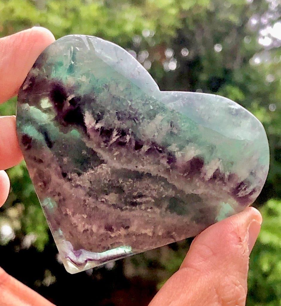 134 Grams Hand Carved Rainbow Fluorite, Polished Heart Shape Crystal For Healing and Home Decor -: This beautifully hand-carved rainbow fluorite heart is a stunning blend of natural beauty and spiritual energy. Weighing 134 grams and measuring 68 × 60 × 20 mm, each piece showcases unique bands of