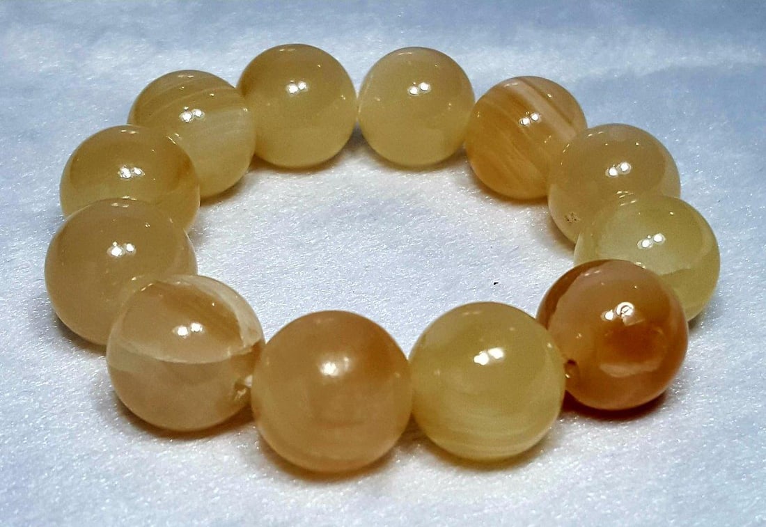 Honey Calcite Bracelet: Honey Calcite Bracelet - Men Women JewelryShipping Rate: $23.00 .shipping rates are determined by Parcel weight and destination.Combined shipping: We offer combine shipping on multiple items purchased