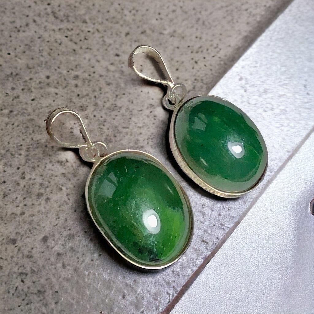 Paired Nephrite Jade pendants (1 of 2)
