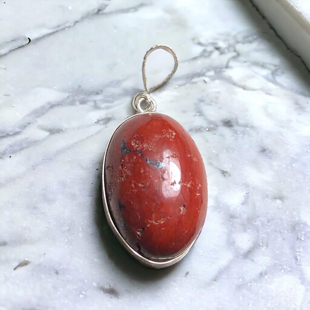 Red Jasper Pendant - Surprise Gift: Red Jasper Pendant - Surprise Gift Shipping: Domestic: Flat-rate of $23.00 to anywhere within the contiguous U.S.International: Foreign shipping rates are determined by destination. International