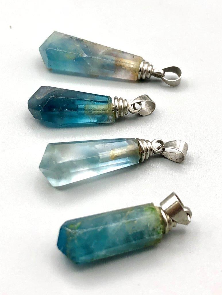 Colourful Fluorite Charms Pendants: Colourful Fluorite Charms Pendants Shipping: $45.00. Shipping rates are determined by Parcel weight and destination.