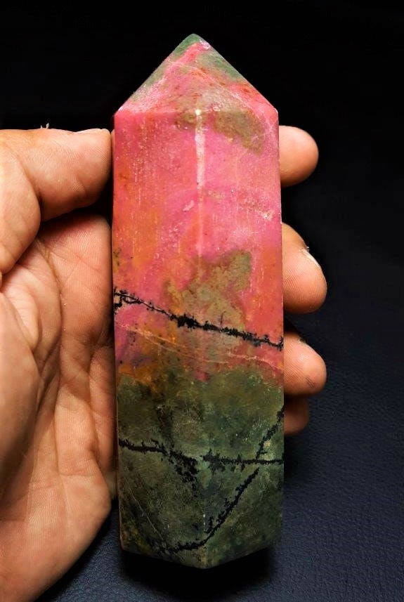 544G Rhodonite tower point healing crystal: 544G Rhodonite tower point healing crystal home decoration - 120X42X40 mm Shipping: $55.00. Shipping rates are determined by Parcel weight and destination.