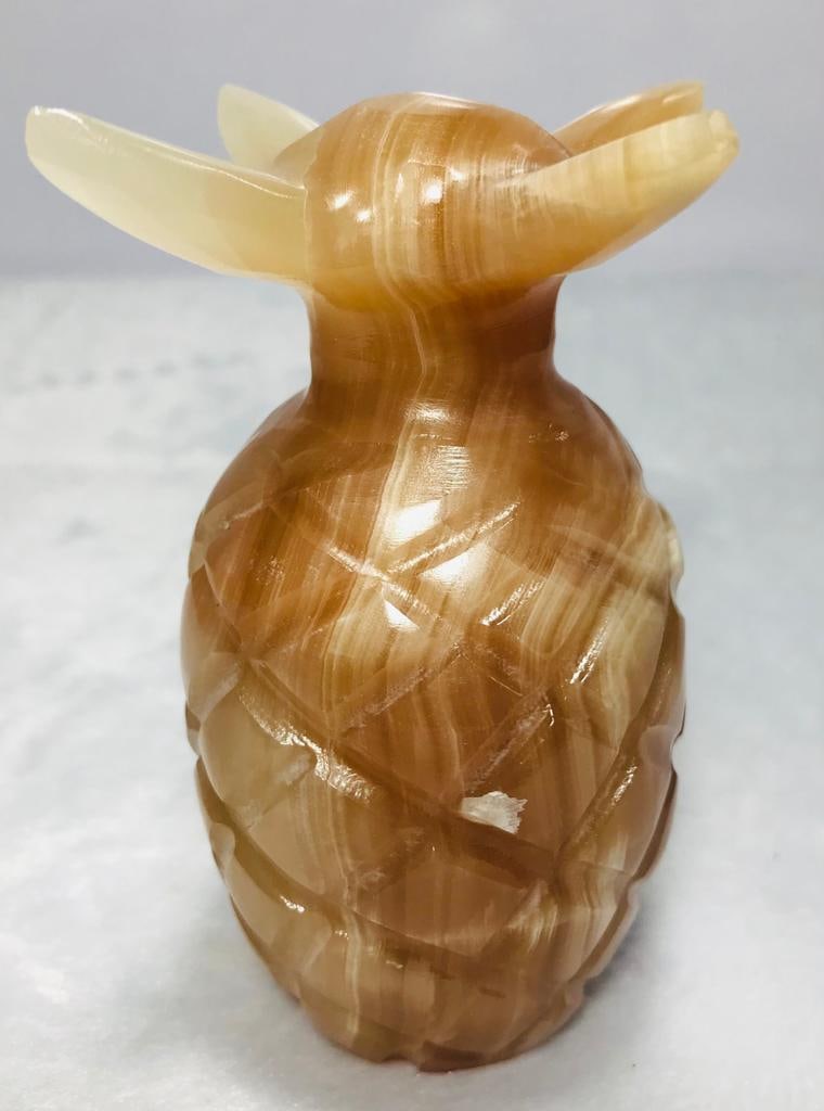 Honey calcite pineapple decoration piece 431.4G: Honey calcite pineapple decoration piece - 105X54mm - 431.4G Shipping: $45.00. Shipping rates are determined by Parcel weight and destination.