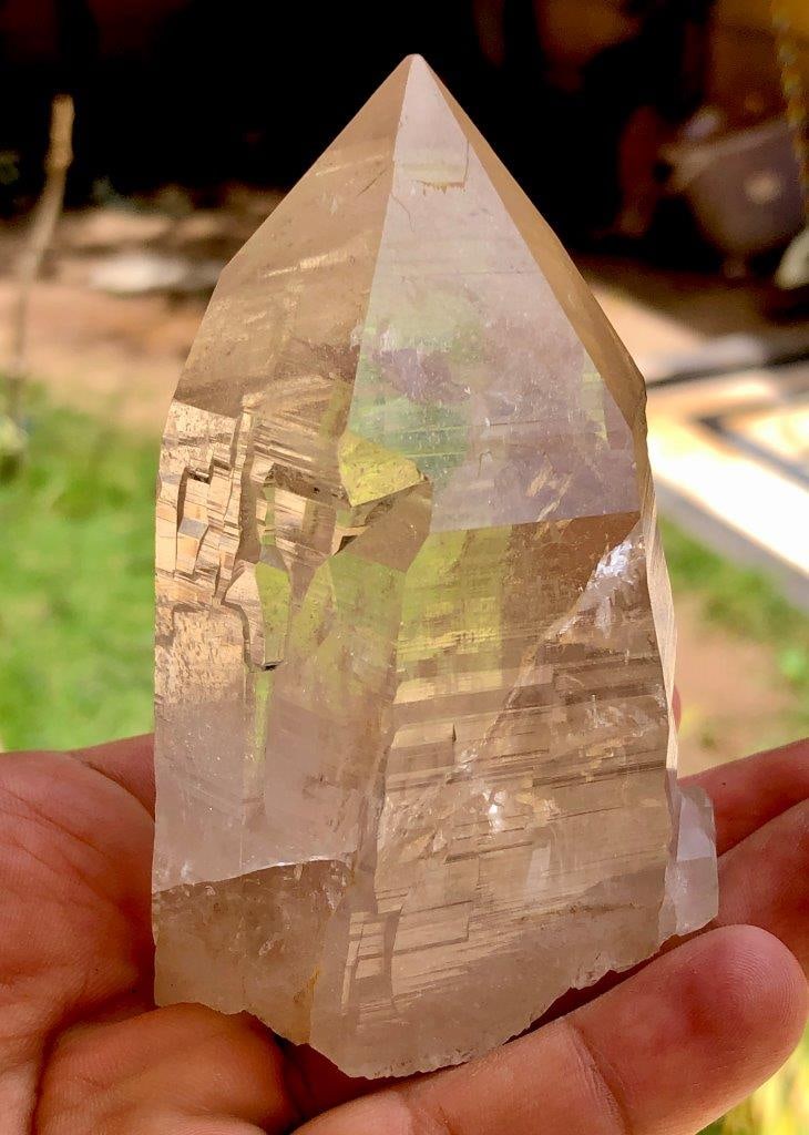 Clear Quartz Mineral Specimen 292 Grams Fully Terminated Crystal Point QTZ002: Discover the raw elegance of item QTZ002, a stunning 292-gram Fully Terminated Natural Clear Quartz Specimen. Measuring 92x46x47 mm, this collector-grade crystal point features crisp, unpolished faces