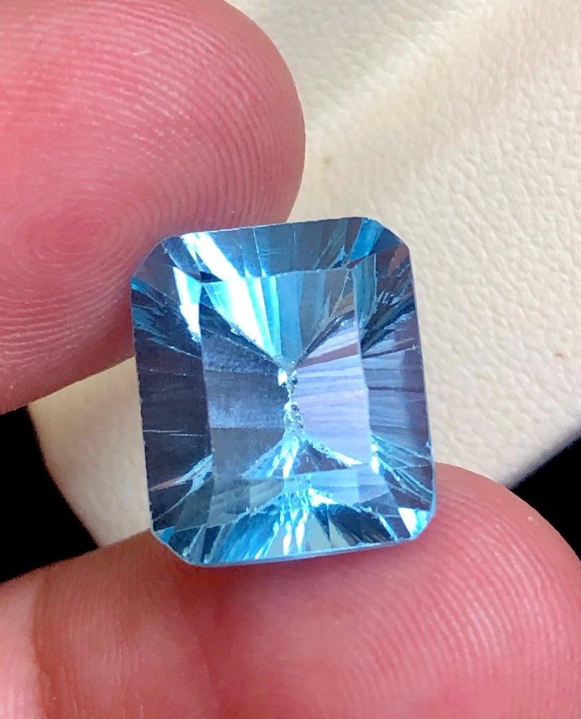 14.35 carats AAA Quality Laser cut Swiss Blue Topaz 14?12?10 mm: 14.35 carats AAA Quality Laser cut Swiss Blue Topaz 14?12?10 mm Shipping Rate: FREE SHIPPINGshipping rates are FREE WORLDWIDECombined shipping: We offer combine shipping on multiple items purchased to
