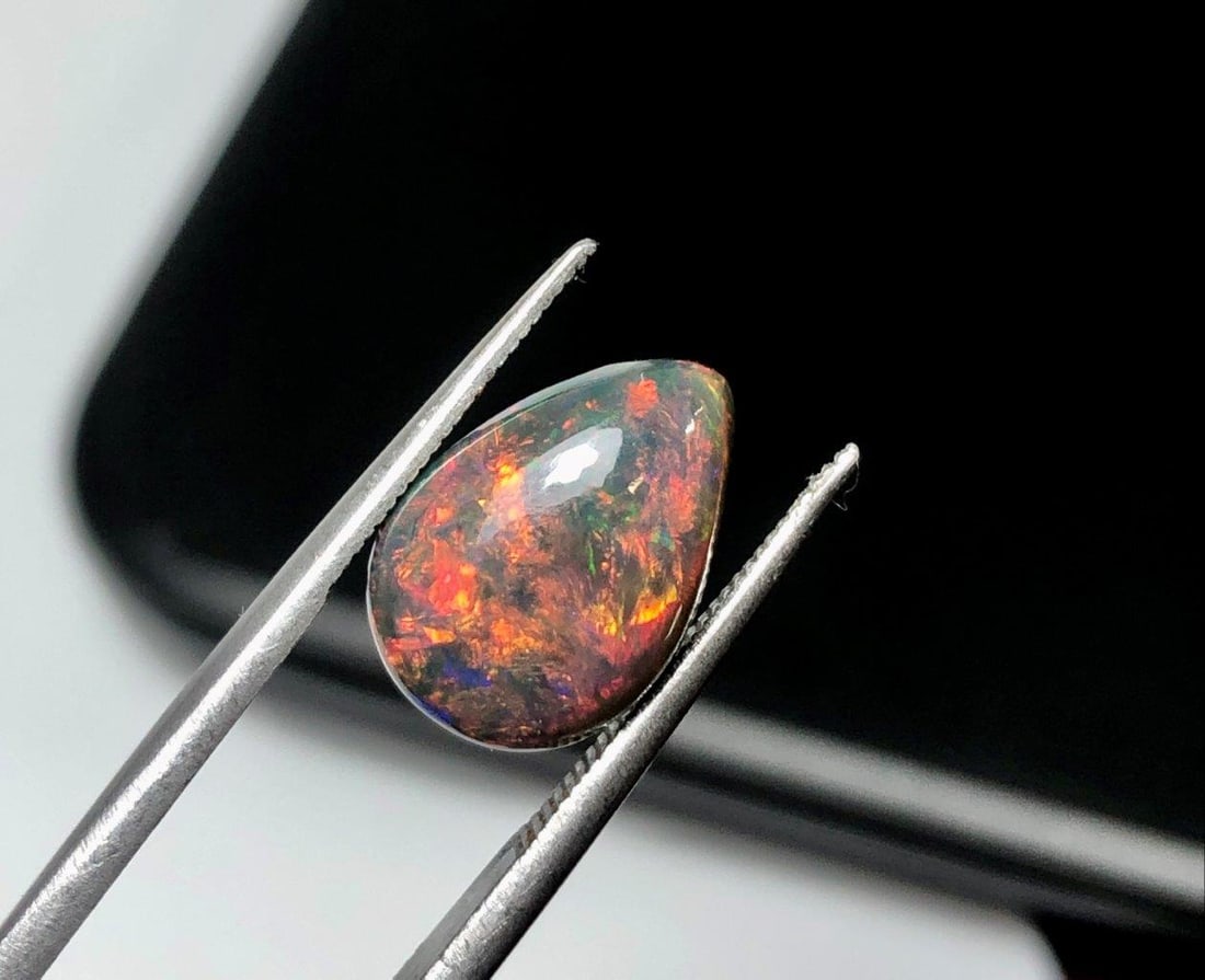 2.70 Carats Brilliant Black Fire Opal Loose Gemstone ? High-Quality Natural Opal - 13X9X5 mm: 2.70 Carats Brilliant Black Fire Opal Loose Gemstone ? High-Quality Natural Opal - 13X9X5 mmShipping Rate: 23$ WorldWideshipping rates are determined by Parcel weight and destination.Combined shipping