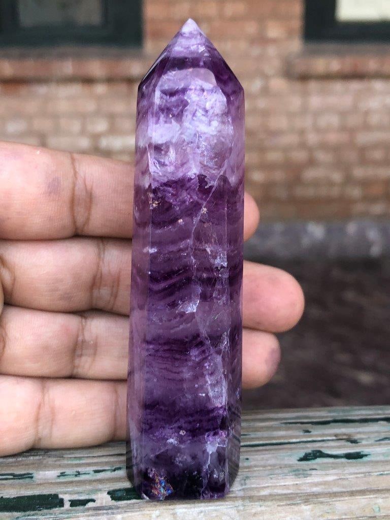 94g Natural Rainbow Fluorite Crystal Tower ? Hexagonal Obelisk Point, Healing Chakra Stone D?cor: Enhance your space with this Natural Rainbow Fluorite Crystal Point Tower, expertly carved into a classic hexagonal obelisk shape. Showcasing beautiful bands of green, purple, and translucent hues, th