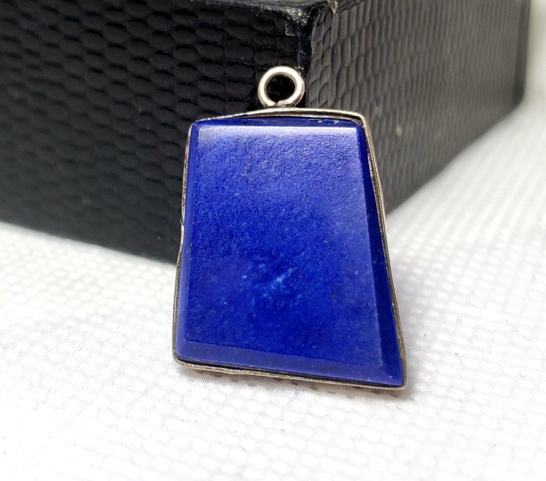 Sterling Silver Lapis Pendant: Sterling Silver Lapis Pendant - 25X19X4.5 mm Shipping: $23.00. Shipping rates are determined by Parcel weight and destination.