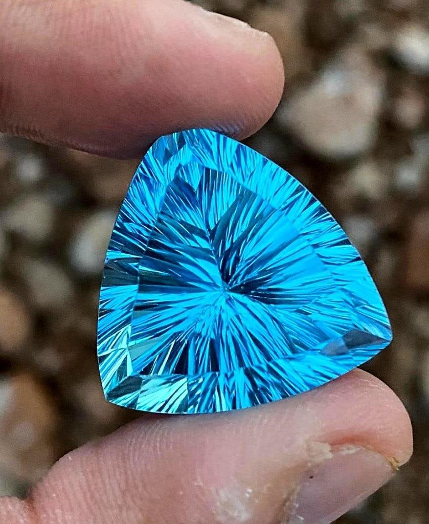Trillian Cut Laser Swiss Blue Topaz - 52 Carats - 25X23X16 mm: Trillian Cut Laser Swiss Blue Topaz - 52 Carats - 25X23X16 mmShipping Rate: $15.00 .shipping rates are determined by Parcel weight and destination.Combined shipping: We offer combine shipping on multi
