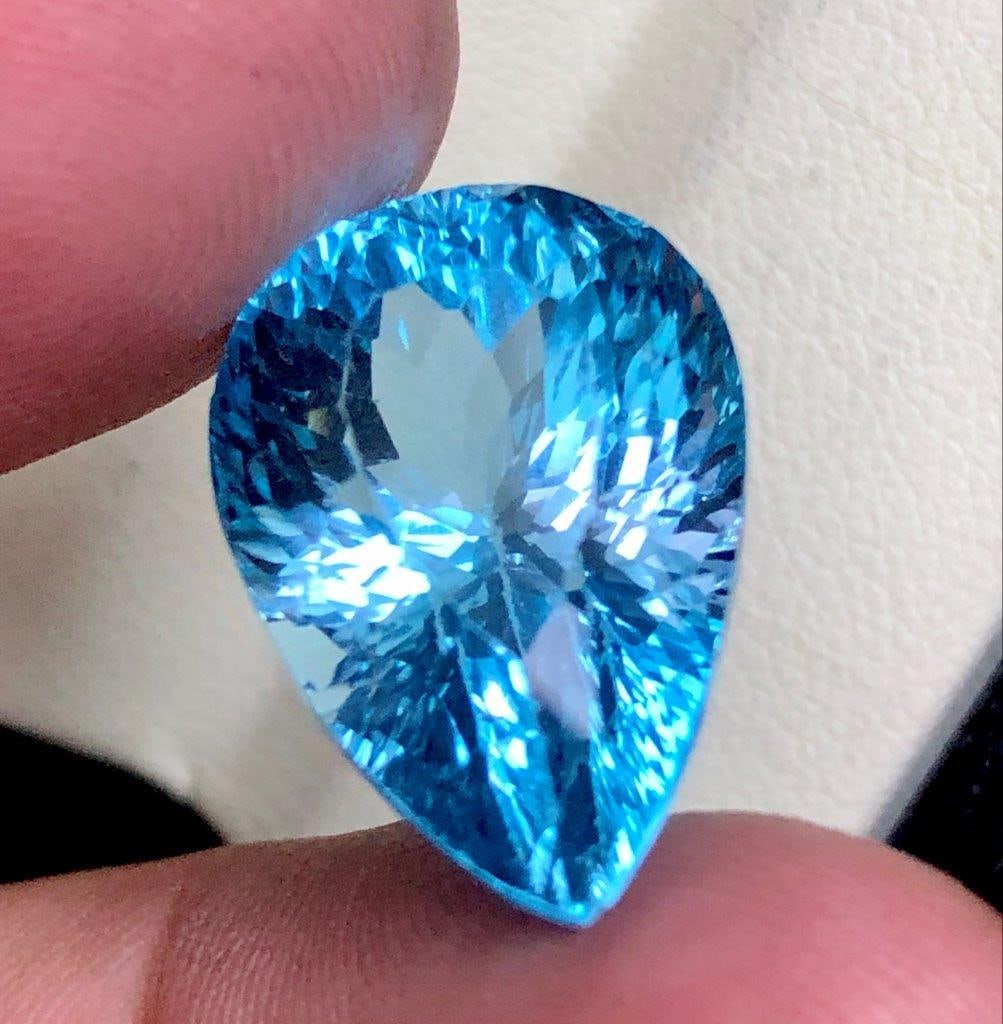21.90 cts Certified Natural Swiss Blue Topaz for Fine Jewelry - 19X13X12 mm: 21.90 cts Certified Natural Swiss Blue Topaz for Fine Jewelry - 19X13X12 mmShipping Rate: 23$ WorldWideshipping rates are determined by Parcel weight and destination.Combined shipping: We offer combin
