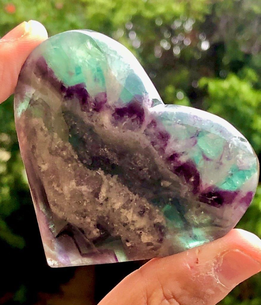 134 Grams Hand Carved Rainbow Fluorite, Polished Heart Shape Crystal For Healing and Home Decor -: This beautifully hand-carved rainbow fluorite heart is a stunning blend of natural beauty and spiritual energy. Weighing 134 grams and measuring 68 ? 60 ? 20 mm, each piece showcases unique bands of v