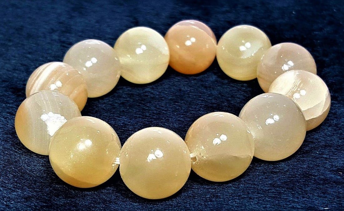 Honey Calcite Bracelet - 18 mm: Honey Calcite Bracelet - 18 mm Shipping: $23.00. Shipping rates are determined by Parcel weight and destination.