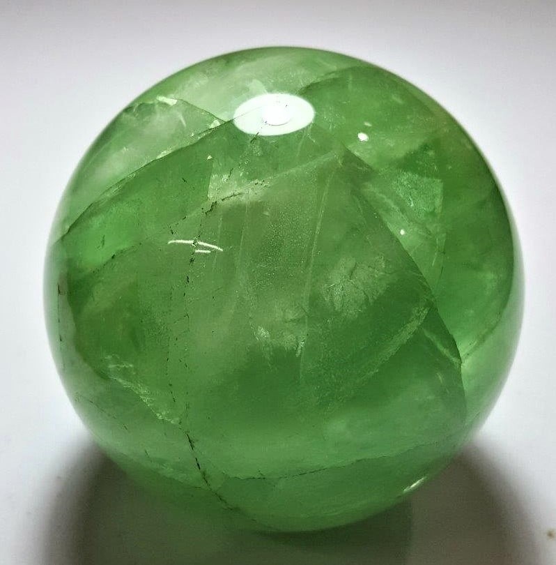 1108 Grams Clear Fluorite Sphere: 1108 Grams Clear Fluorite Sphere - Diameter 86 mmShipping Rate: $75.00 .shipping rates are determined by Parcel weight and destination.Combined shipping: We offer combine shipping on multiple items pu