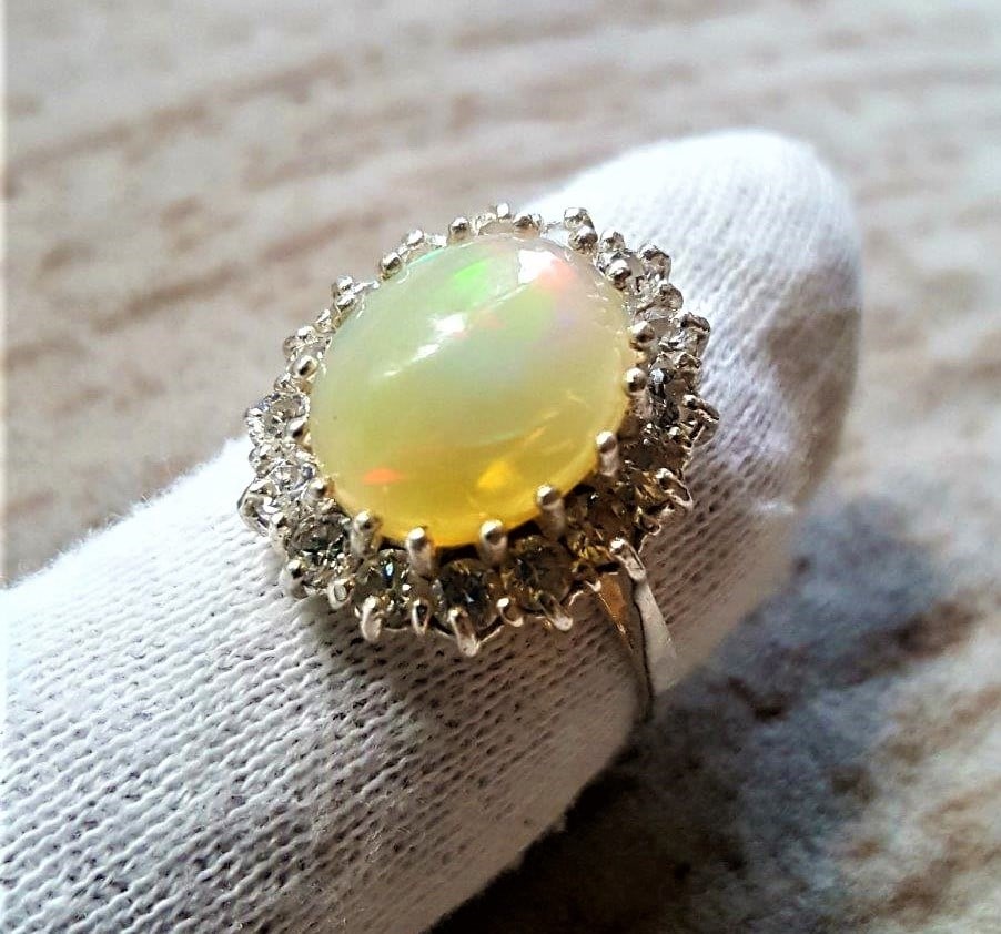 Sterling Silver White Ethopian Opal Ring: Sterling Silver White Ethopian Opal RingShipping Rate: $85.00 .shipping rates are determined by Parcel weight and destination.Combined shipping: We offer combine shipping on multiple items purchased t