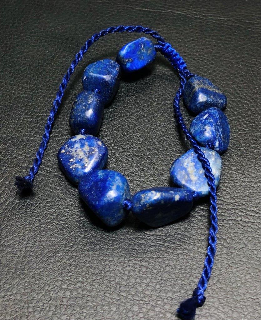 Natural raw lapis lazuli bracelet: Natural raw lapis lazuli bracelet, genuine boho bracelet Shipping: $23.00. Shipping rates are determined by Parcel weight and destination.
