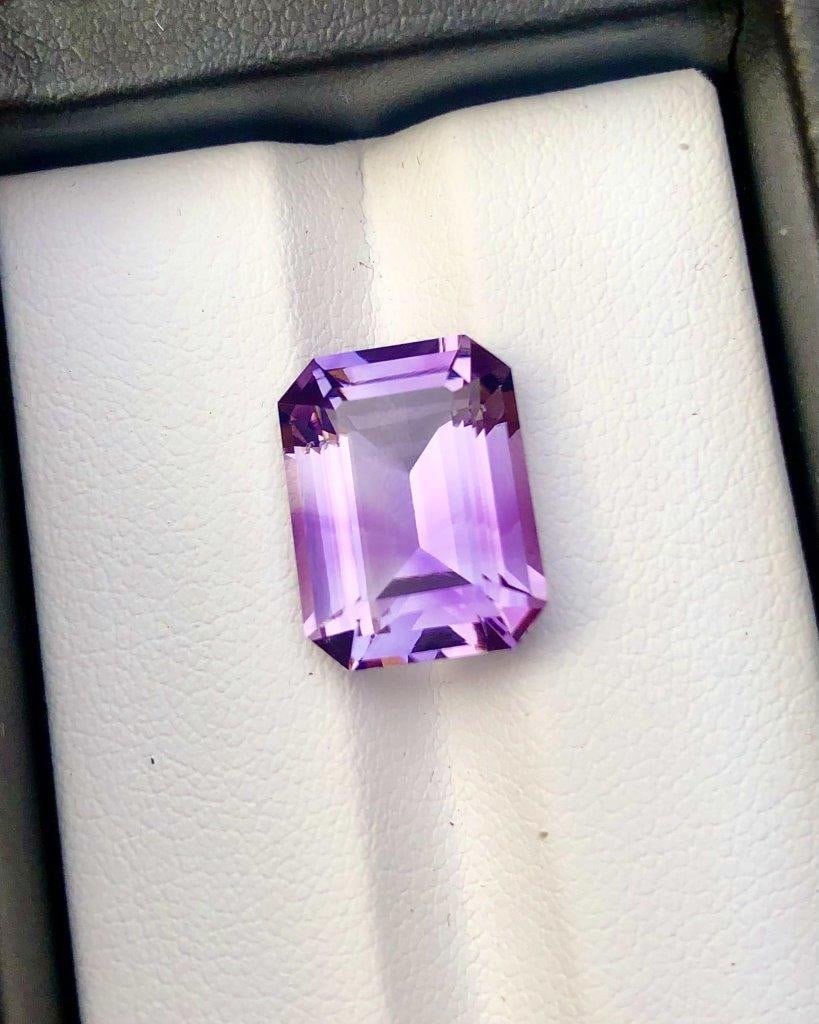 Emerald Cut Natural Ametrine - 7.20 Carats - 14X10X7 mm: Emerald Cut Natural Ametrine - 7.20 Carats - 14X10X7 mm Shipping Rate: $15.00 .shipping rates are determined by Parcel weight and destination.Combined shipping: We offer combine shipping on multiple i
