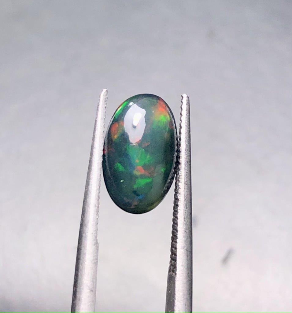 1.10 Carats Natural Black Opal - 10X7X4 mm: 1.10 Carats Natural Black Opal - 10X7X4 mm Shipping: