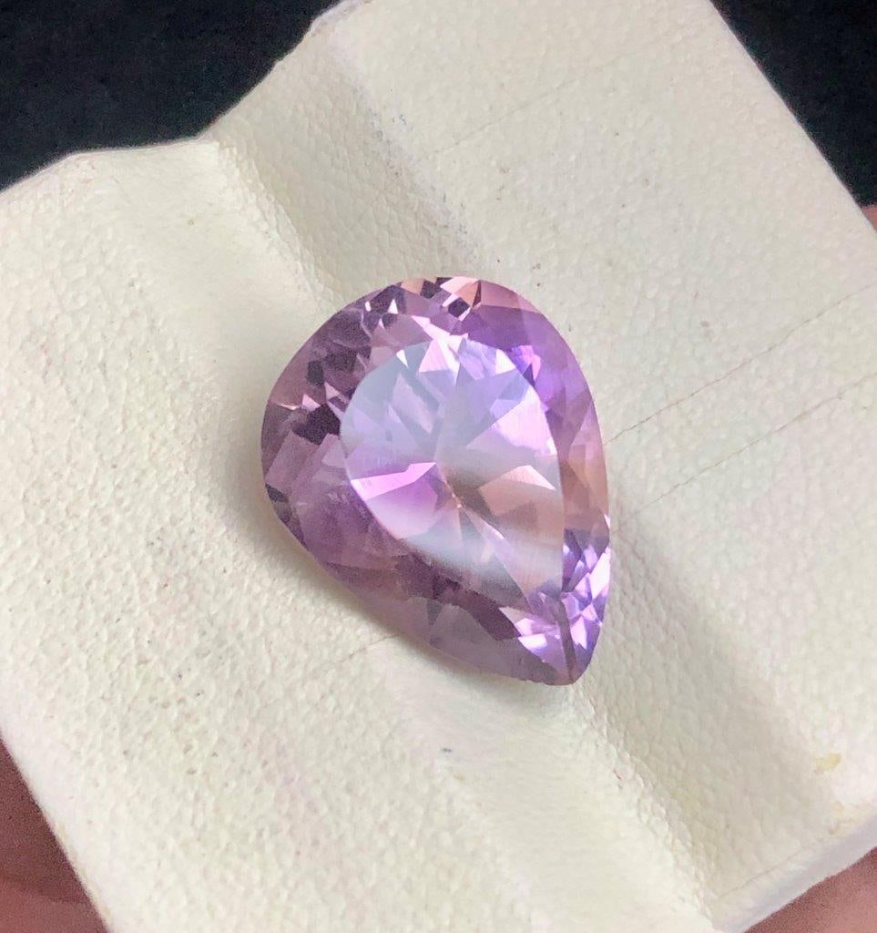 8.25 cts Pear Shape Natural Ametrine Loose Gemstone - 18X12X8 mm: 8.25 cts Pear Shape Natural Ametrine Loose Gemstone - 18X12X8 mmShipping Rate: 23$ WorldWideshipping rates are determined by Parcel weight and destination.Combined shipping: We offer combine shipping 
