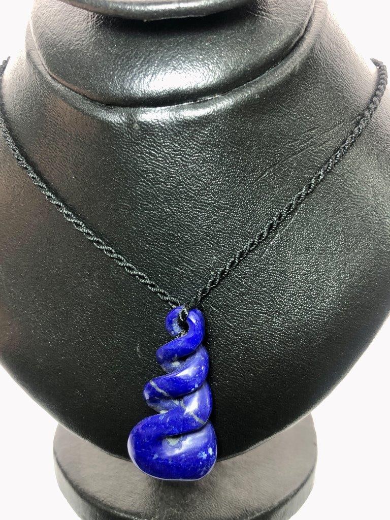 Hand-Carved Lapis Lazuli Pendant in Silver | Natural Gemstone Jewelry: Genuine natural Lapis Lazuli gemstoneExpertly hand-carved designRich royal-blue color with natural golden flecksUnique one-of-a-kind pendantSuitable for everyday wear and special occasionsExcellent gi