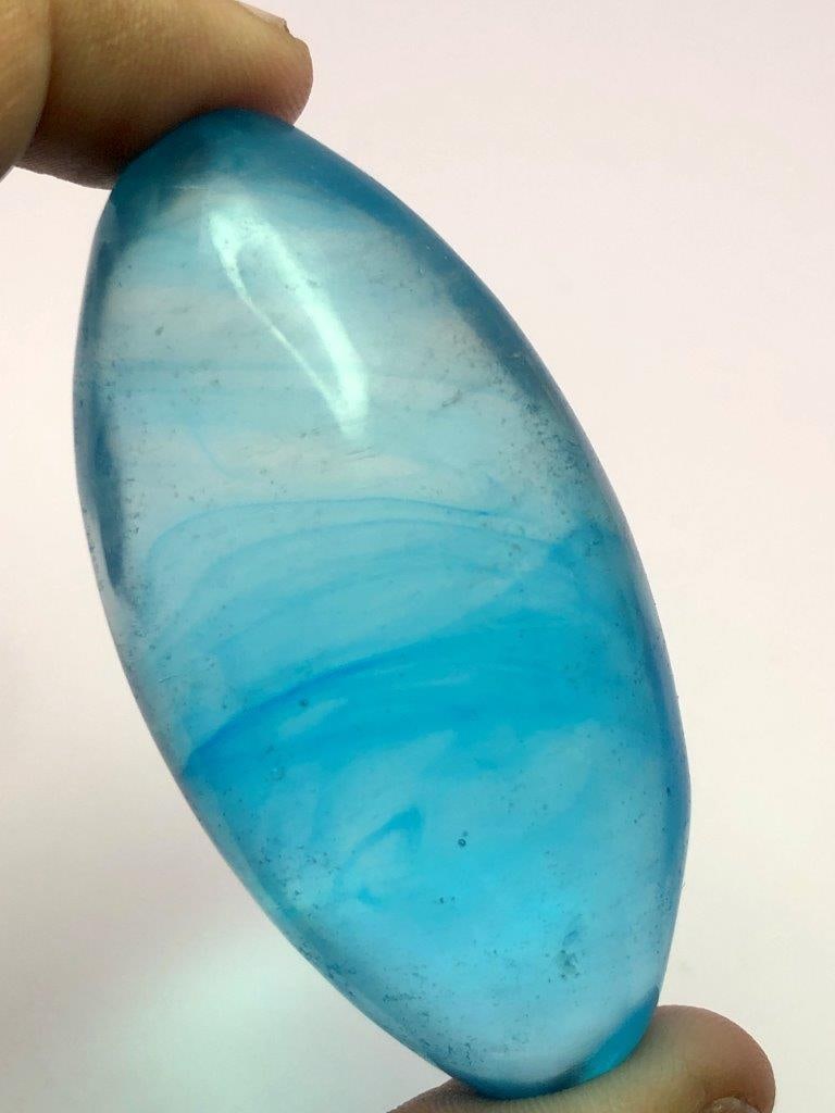 Carved Blue Natural Glass Egg ? Handcrafted Decorative Collectible: This exquisite carved blue natural glass egg is a stunning example of artisanal craftsmanship. Carefully hand-carved from high-quality natural glass, it features intricate detailing and a smooth, poli