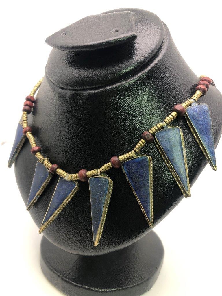 Vintage Hand Carved Lapis Lazuli Necklace ? Natural Deep Blue Stone: an elegant hand carved lapis lazuli necklace showcasing the rich royal blue coloration for which this gemstone is prized. The stone displays natural variations and may show subtle pyrite inclusions, a