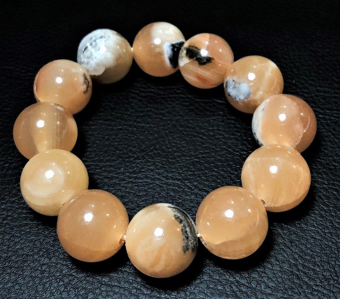 Genuine Honey Calcite Crystal Healing Bracelet: Genuine Honey Calcite Crystal Healing Bracelet Shipping: $23.00. Shipping rates are determined by Parcel weight and destination.