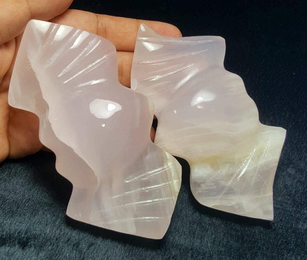 Paired Polished Pink Calcite Wings: Paired Polished Pink Calcite Wings Shipping: $23.00. Shipping rates are determined by Parcel weight and destination.