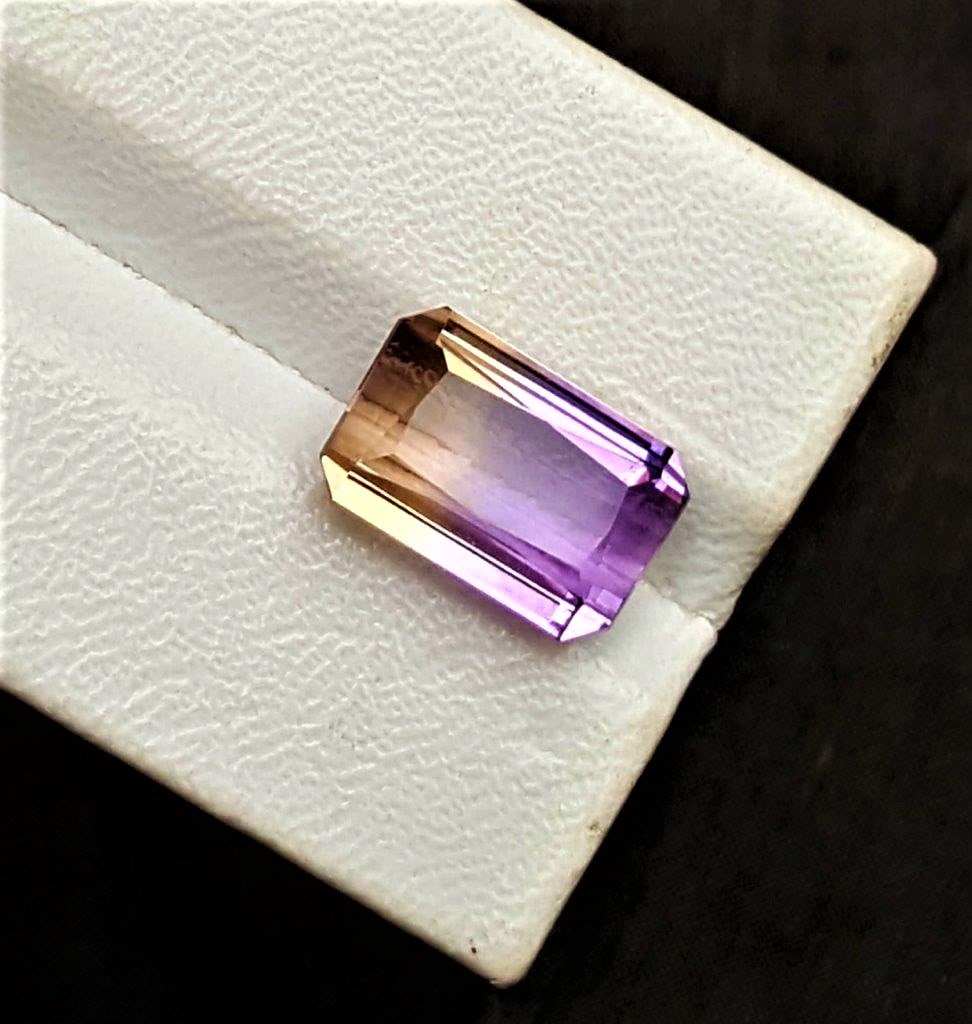 Bolivian Ametrine Stone - 9.5 Carats: Bolivian Ametrine Stone - 9.5 CaratsShipping Rate: $15.00 .shipping rates are determined by Parcel weight and destination.Combined shipping: We offer combine shipping on multiple items purchased to re