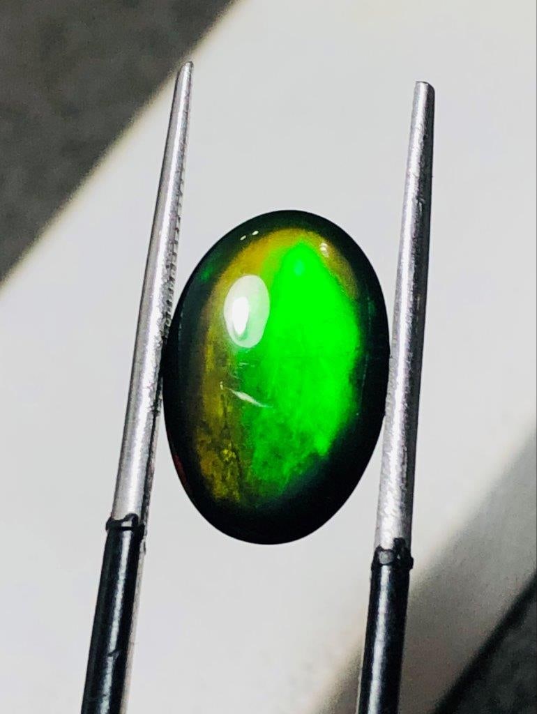Black Fire Opal - 3.55 Carats: Black Fire Opal - 3.55 Carats - 14X10X6 mmShipping Rate: $15.00 .shipping rates are determined by Parcel weight and destination.Combined shipping: We offer combine shipping on multiple items purchased